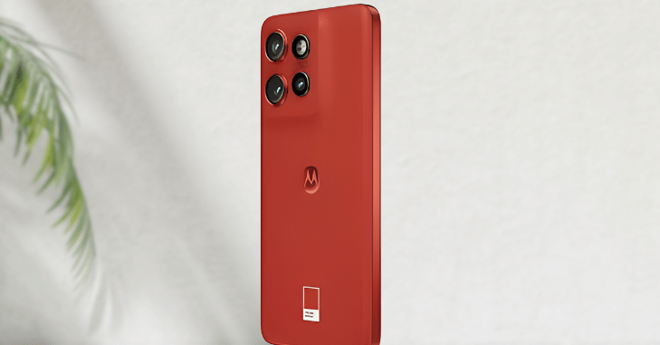 Hand holding a slim Motorola smartphone